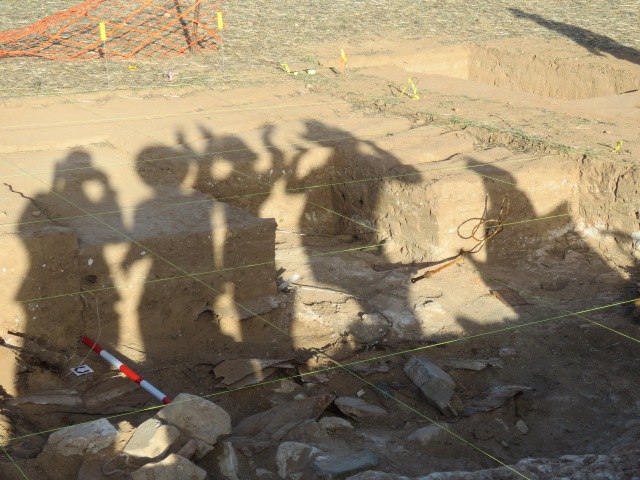 Shadows of archaeologists dancing.