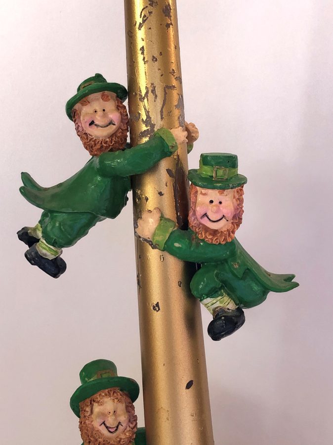 Leprechauns on a gold candle