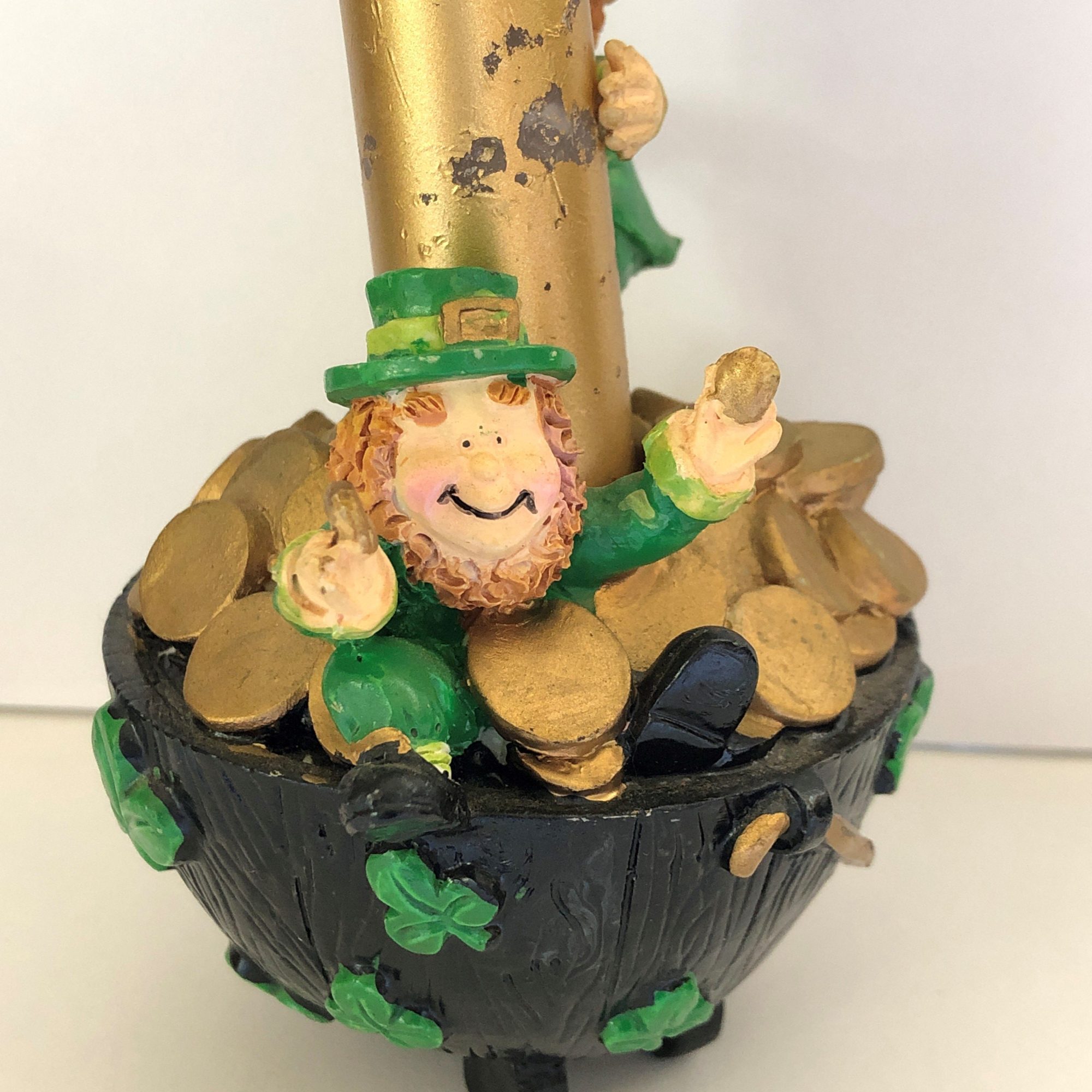 Leprechaun sitting on pot of gold